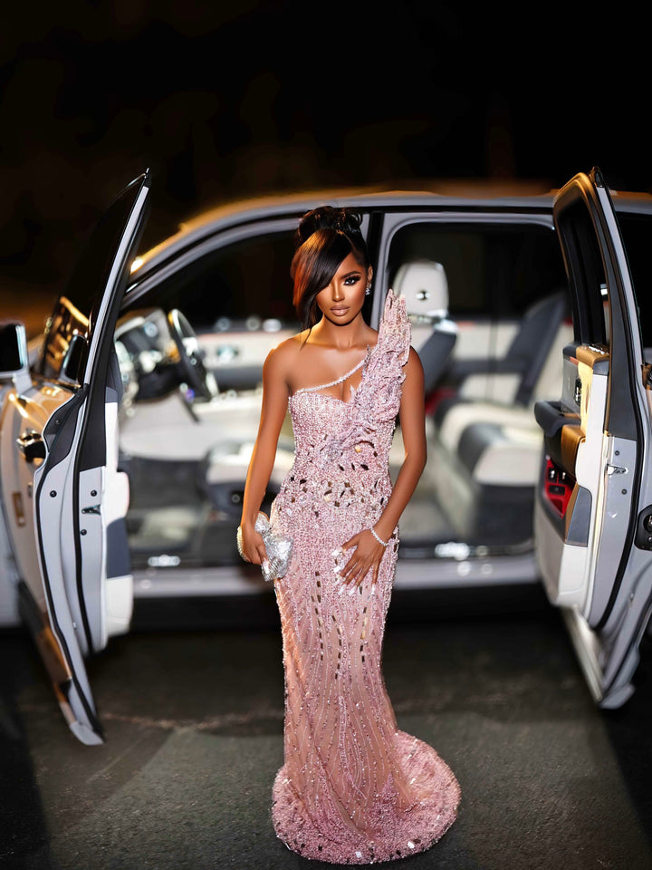 Pink crystal one-shoulder corset gown showing couture construction