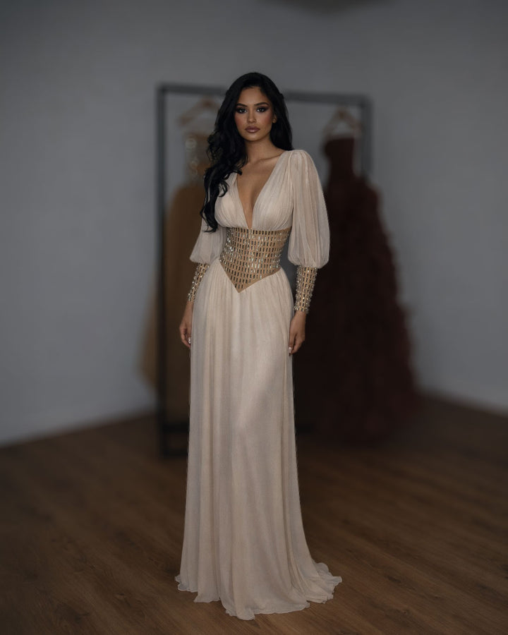 Champagne gold couture chiffon evening gown with corset waist and long sleeves