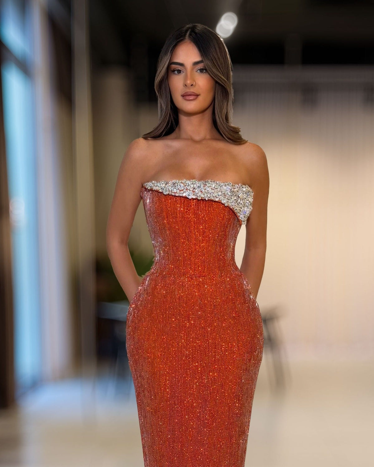 Copper orange strapless corset gown with silver crystal embellished neckline