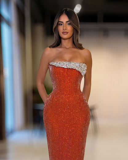 Copper orange strapless corset gown with silver crystal embellished neckline