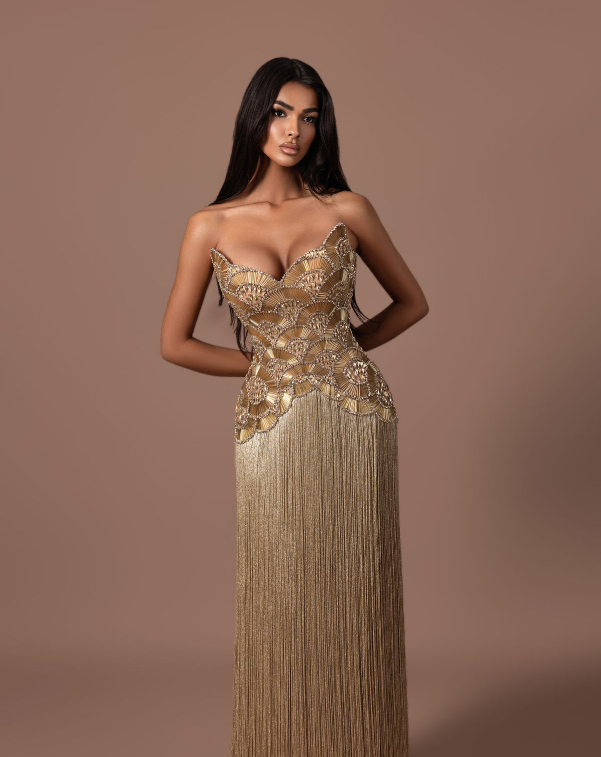 Gold beaded corset evening gown with sculpted strapless bodice
