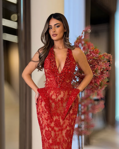 Red lace halter corset gown with crystal plunge neckline and sculpted hips, angled view