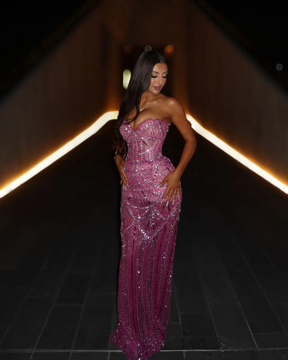 Rose pink crystal beaded strapless mermaid gown with sculpted waist, three-quarter evening look